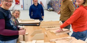 people working with wood in a makerspace